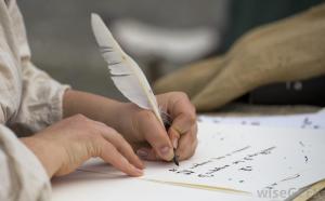 person-with-white-quill-and-paper